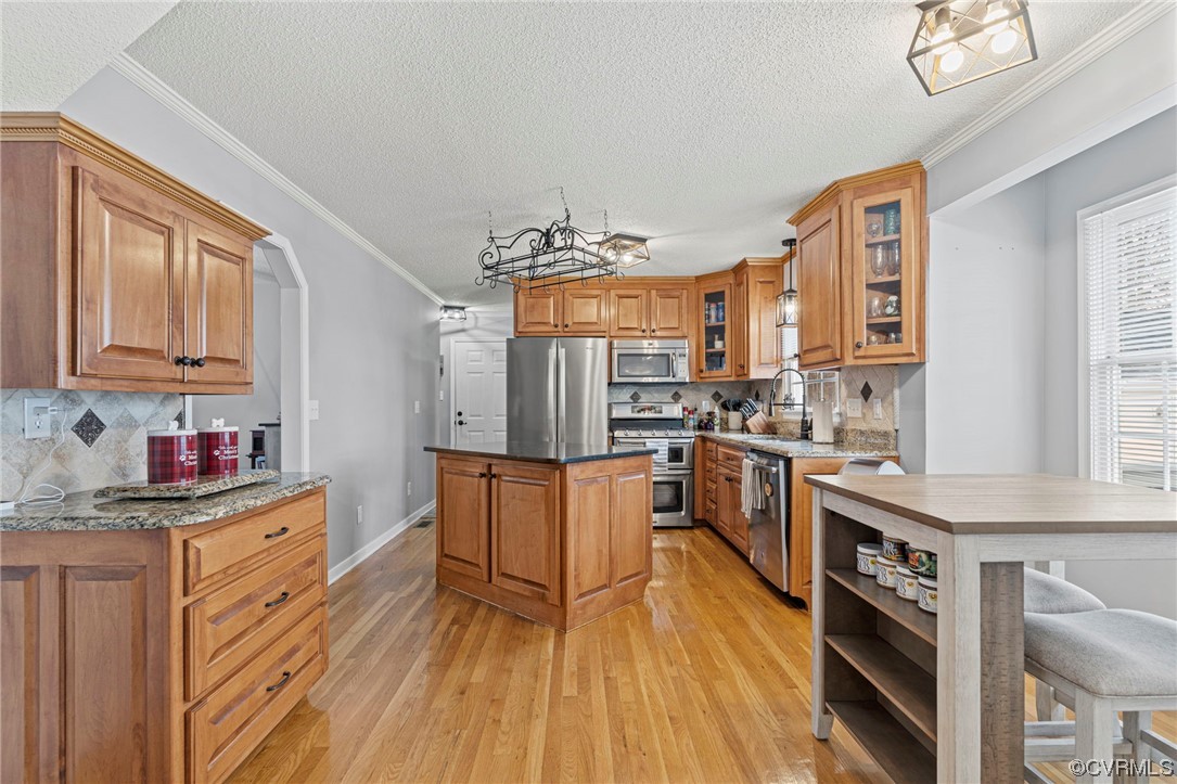 6441 Blair Court Prince George, VA 23875 - Photo 10 of 46 a kitchen with stainless steel appliances a sink cabinets and wooden floor