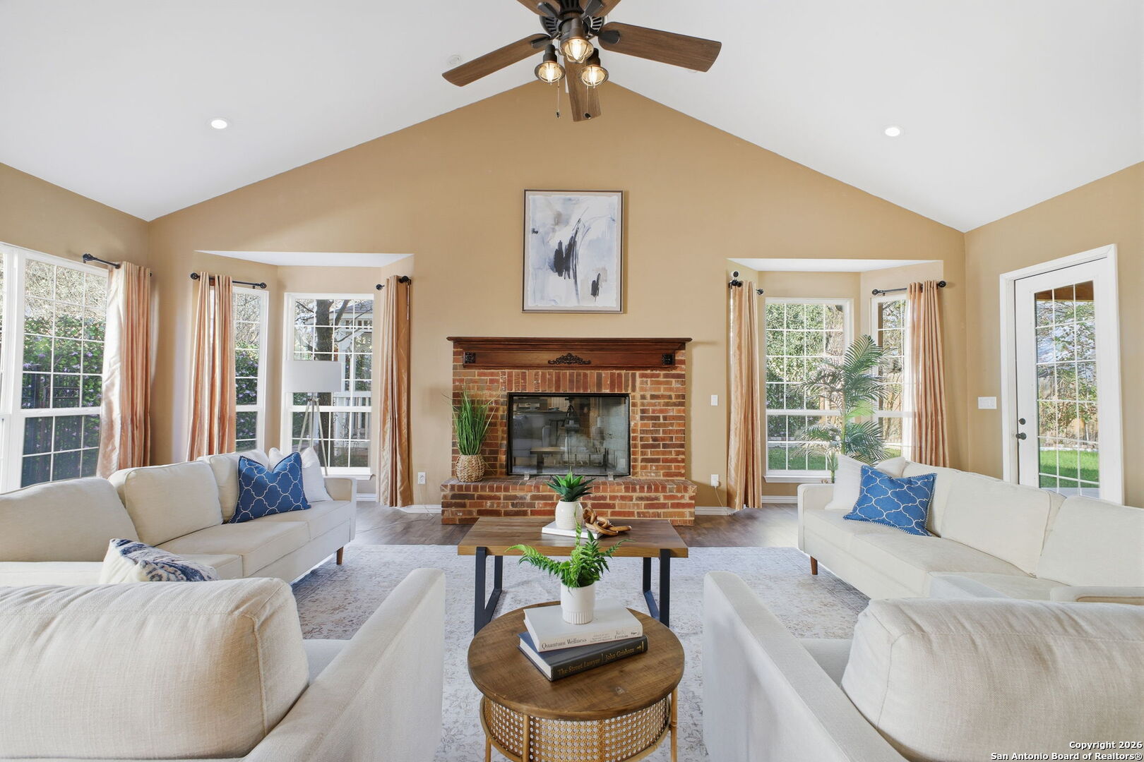 527 Mesa Ridge San Antonio, TX 78258 - Photo 13 of 25 a living room with furniture fireplace and a large window