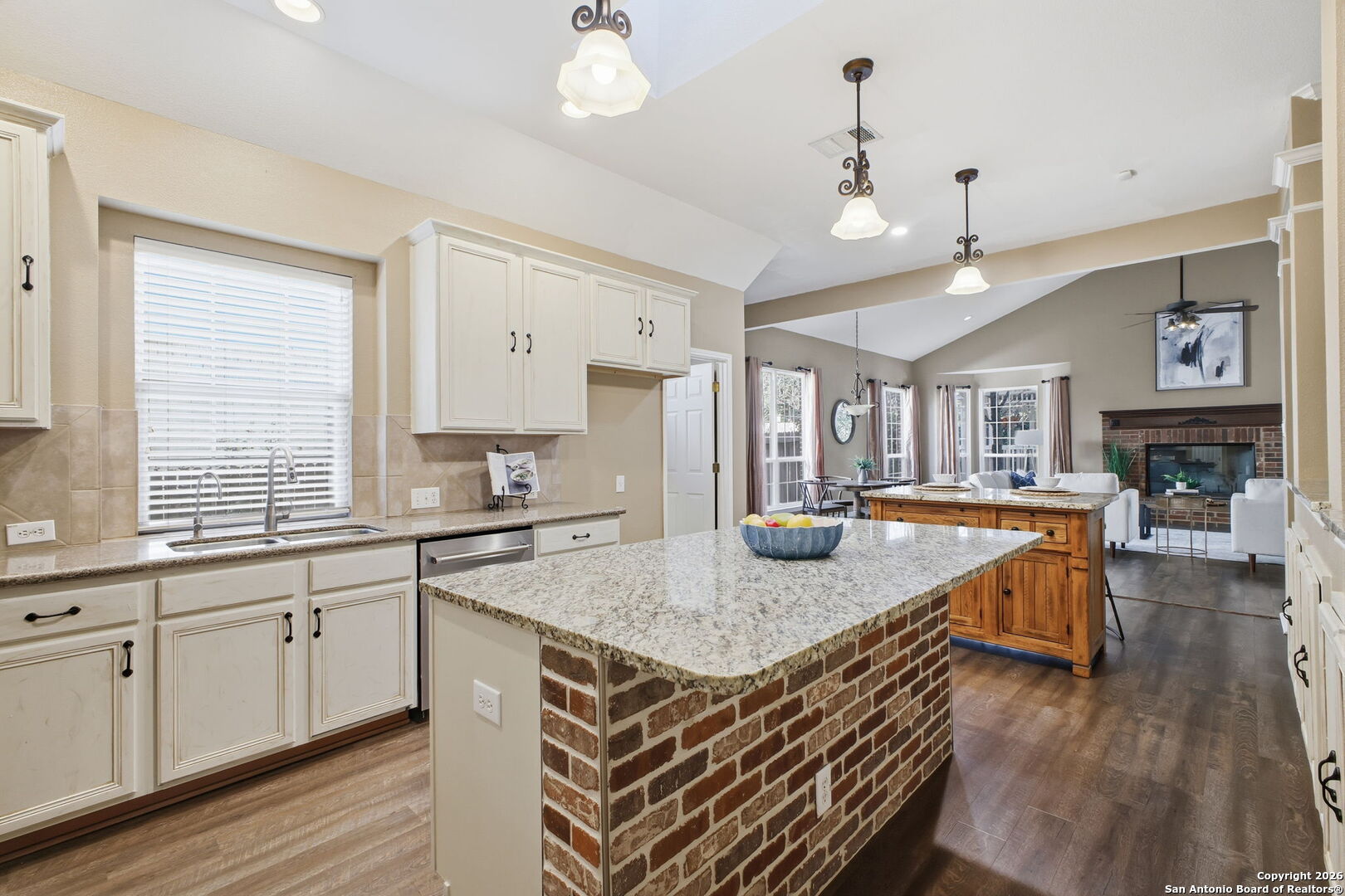 527 Mesa Ridge San Antonio, TX 78258 - Photo 15 of 36 a kitchen with stainless steel appliances granite countertop a kitchen island a stove and a sink