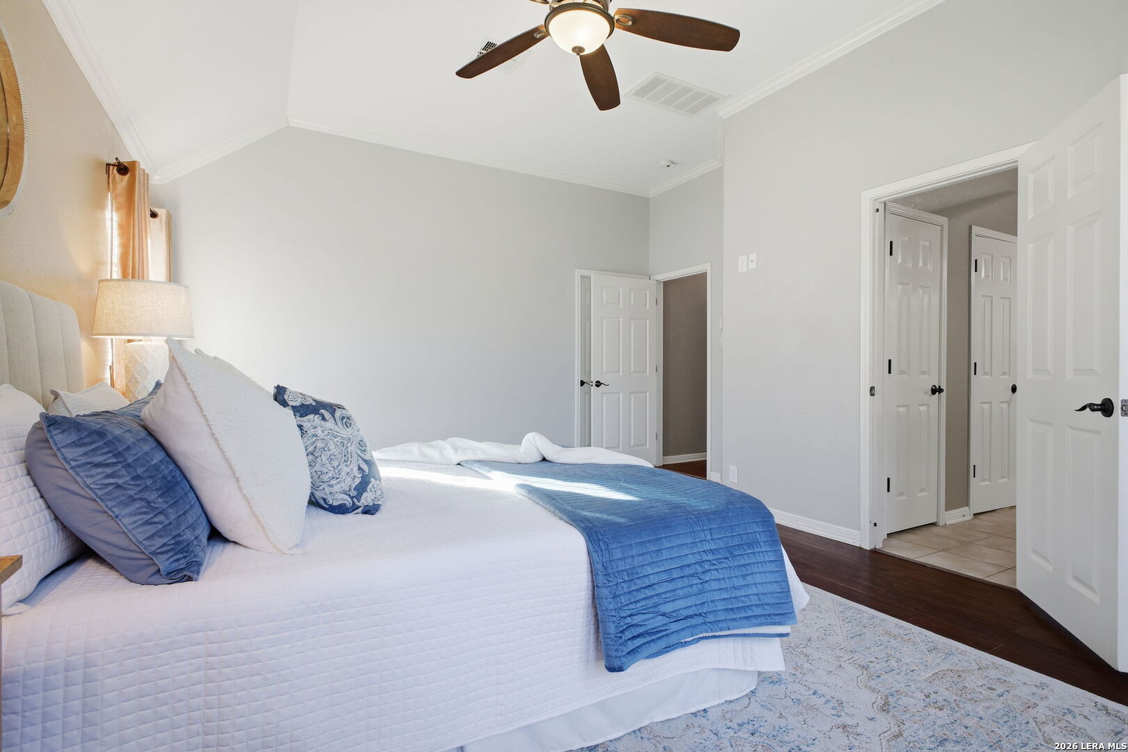 527 Mesa Ridge San Antonio, TX 78258 - Photo 17 of 25 a bedroom with a bed and a walk in closet