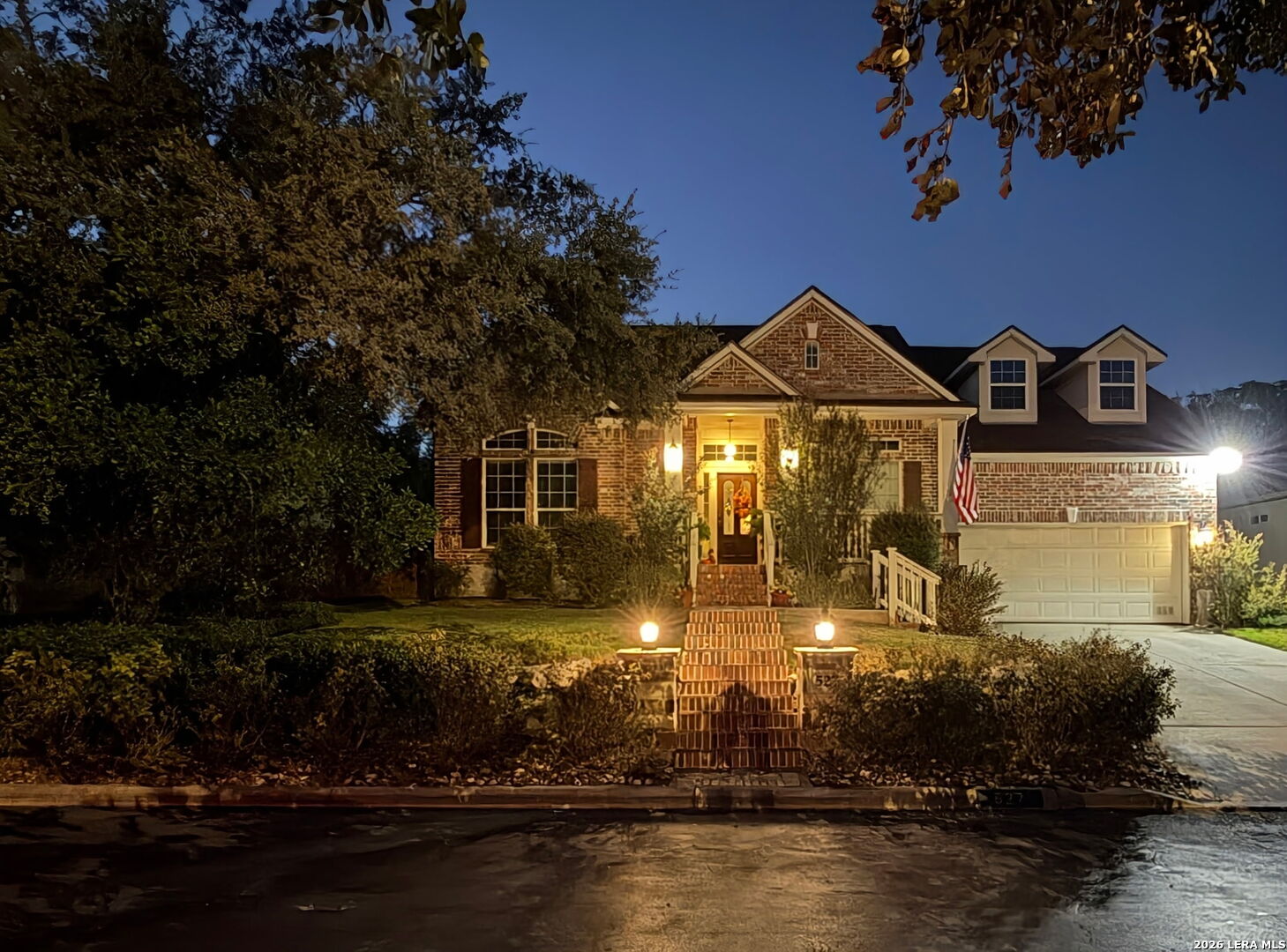 527 Mesa Ridge San Antonio, TX 78258 - Photo 2 of 36 a front view of a house with a yard