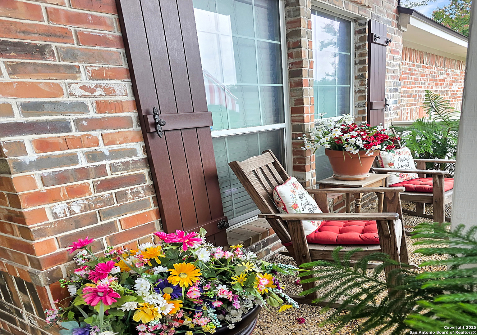 527 Mesa Ridge San Antonio, TX 78258 - Photo 2 of 25 a view of a chairs and table in a backyard