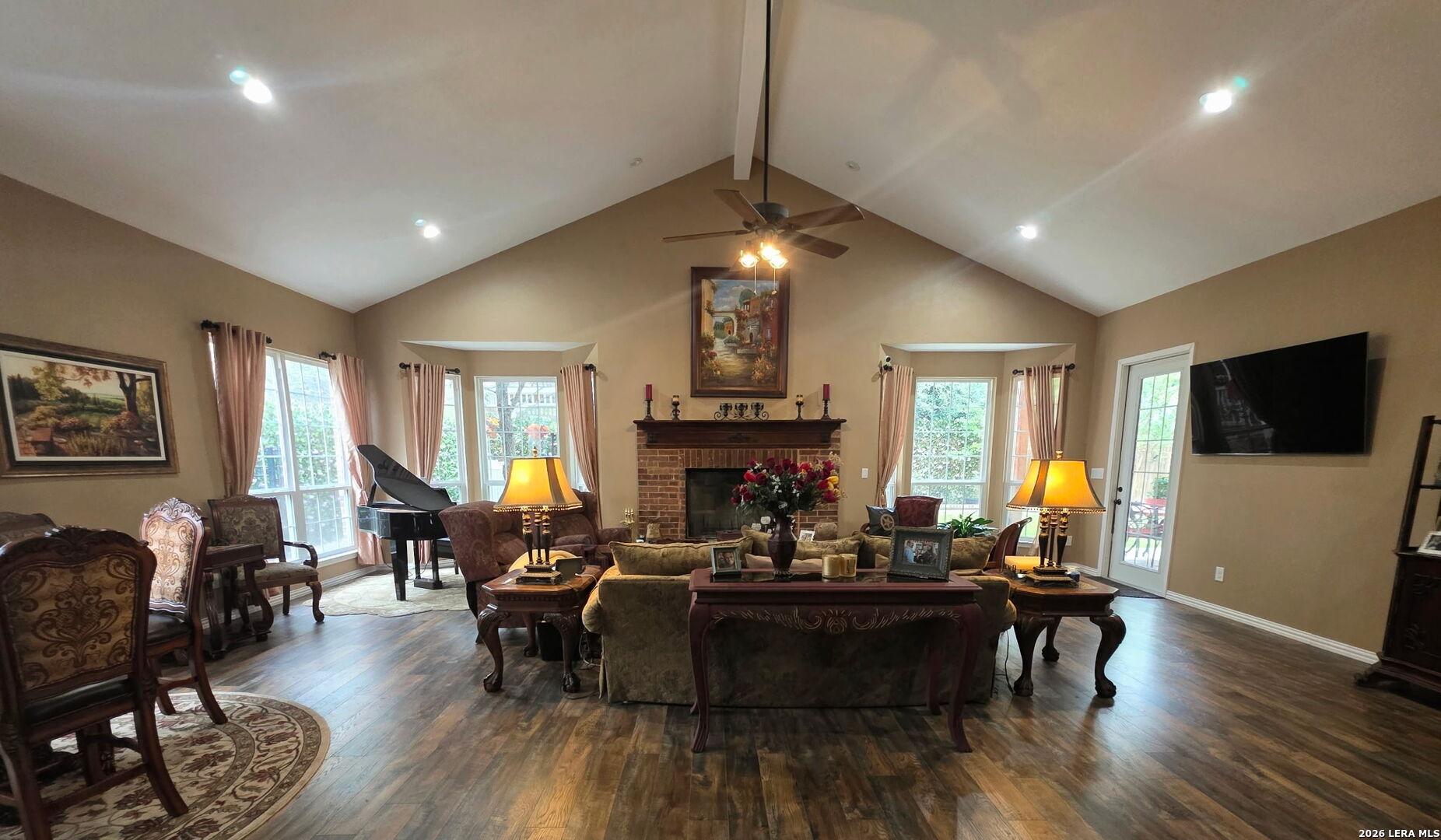 527 Mesa Ridge San Antonio, TX 78258 - Photo 21 of 36 a living room with fireplace furniture and a flat screen tv