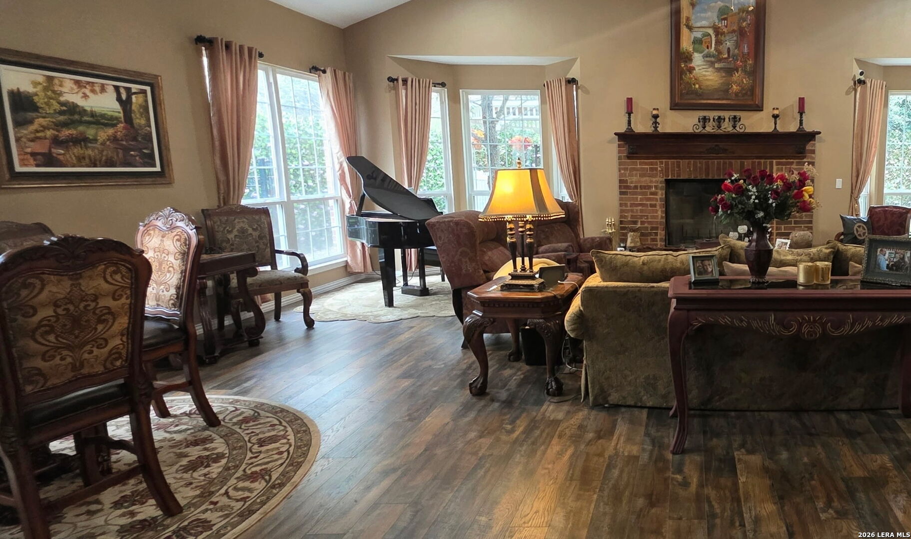 527 Mesa Ridge San Antonio, TX 78258 - Photo 22 of 36 a living room with fireplace furniture and a large window