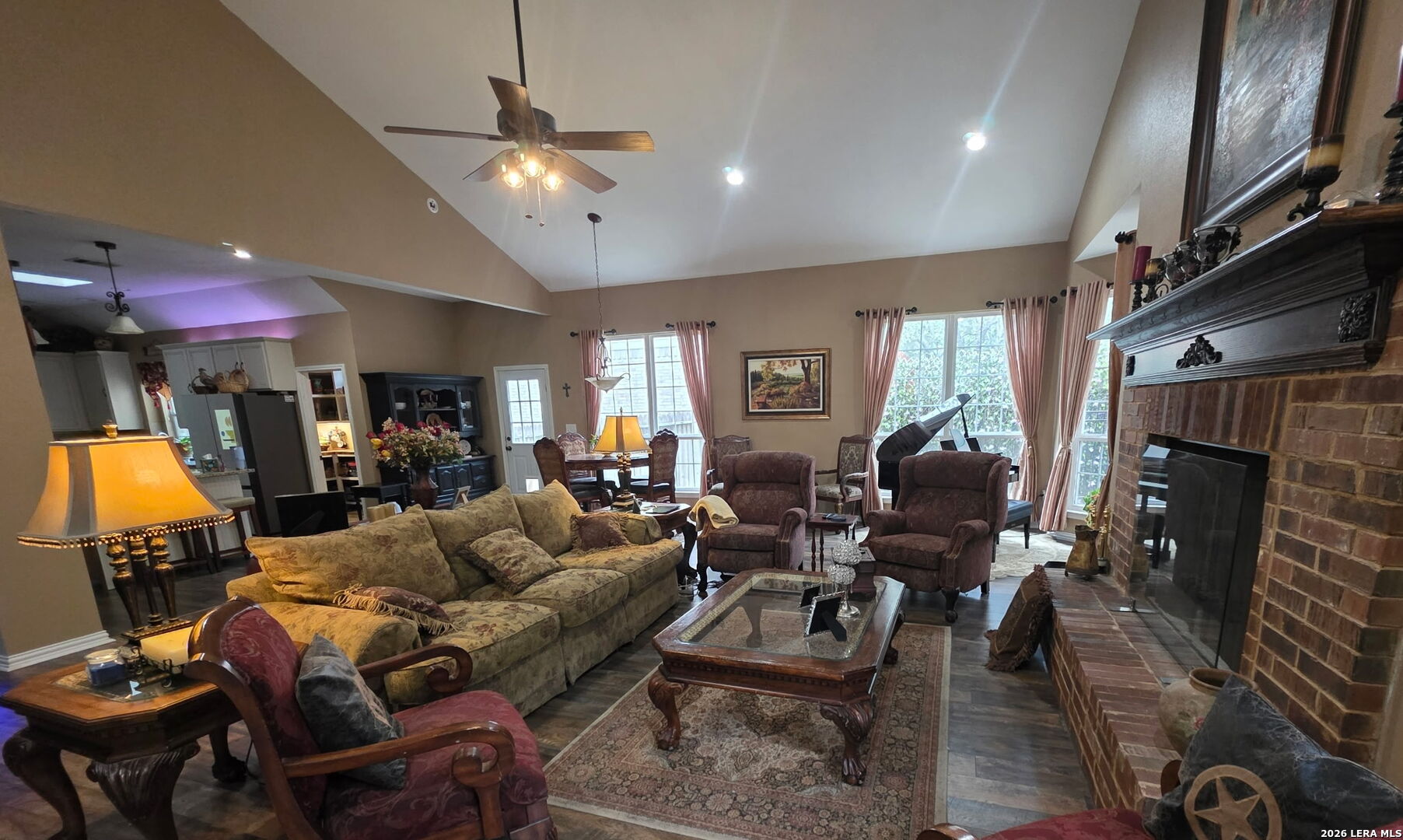 527 Mesa Ridge San Antonio, TX 78258 - Photo 23 of 36 a living room with furniture a fireplace and a flat screen tv