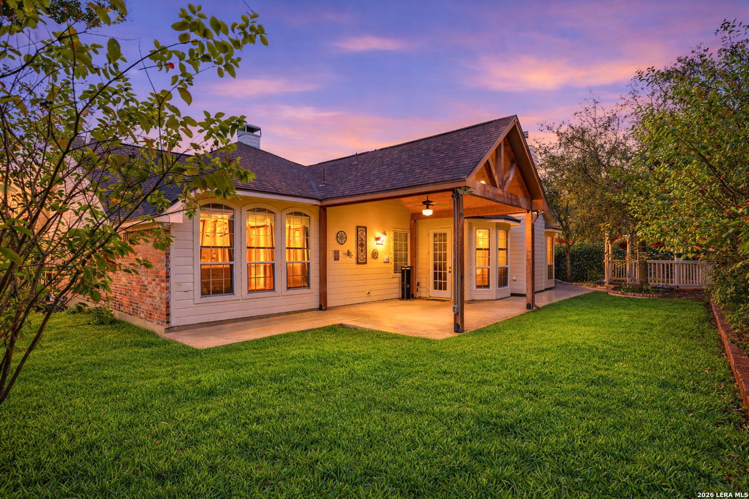 527 Mesa Ridge San Antonio, TX 78258 - Photo 27 of 36 a view of a house with a yard