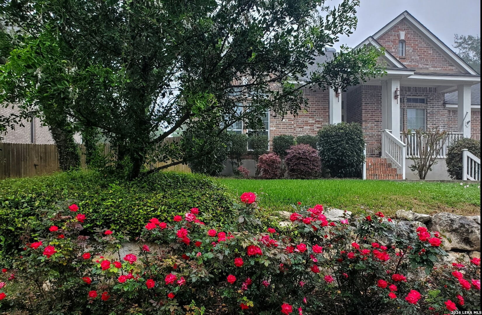 527 Mesa Ridge San Antonio, TX 78258 - Photo 4 of 36 a view of a flower garden in front of house