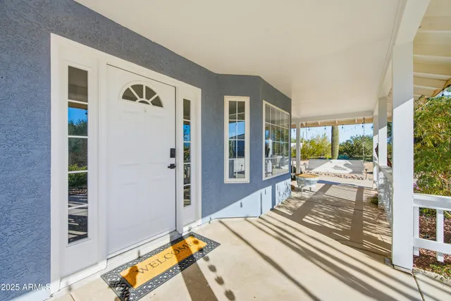 a view of a patio with furniture and a fire pit