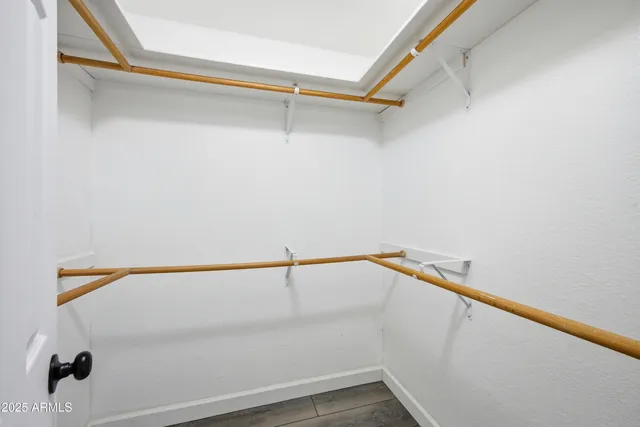 a bathroom with a sink vanity and a mirror