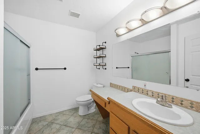 a utility room with sink dryer and washer