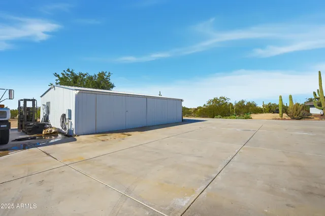 a kitchen with stainless steel appliances kitchen island granite countertop a sink and cabinets