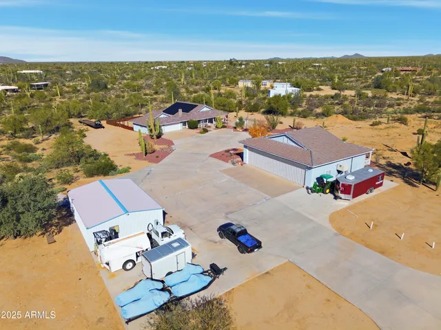 an aerial view of residential building with parking space