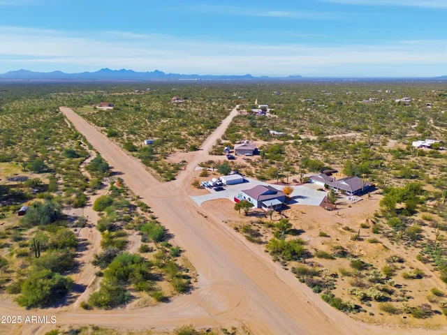 an aerial view of a house with a swimming pool
