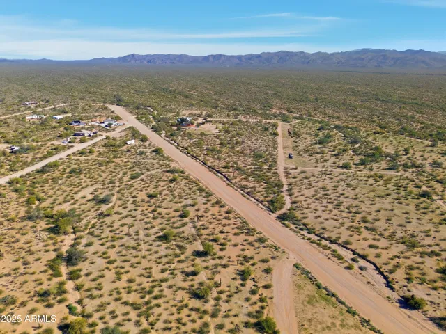 an aerial view of residential building and ocean