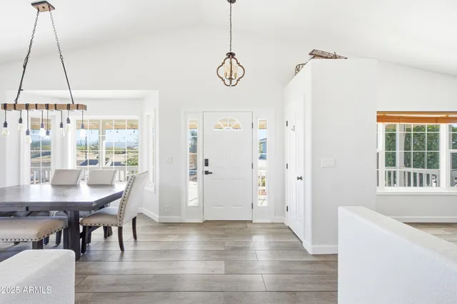 a view of a dining room with furniture window and wooden floor