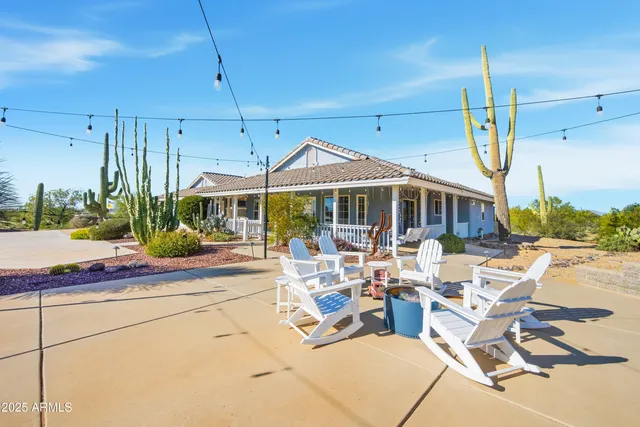 a living room with a large window and a table