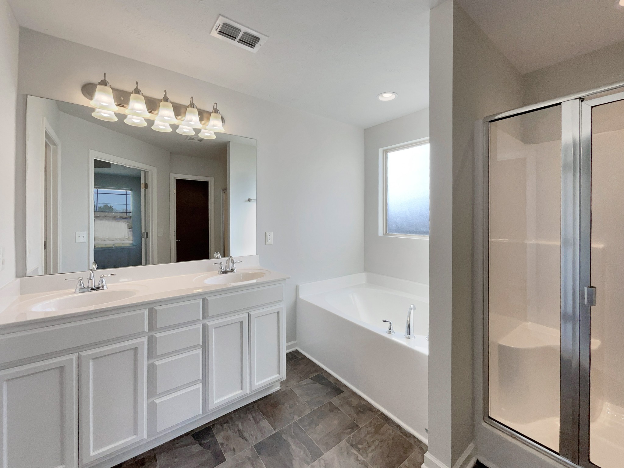 113 Copper Leaf Road Murfreesboro, TN 37128 - Photo 13 of 23 a spacious bathroom with a double vanity sink and a mirror