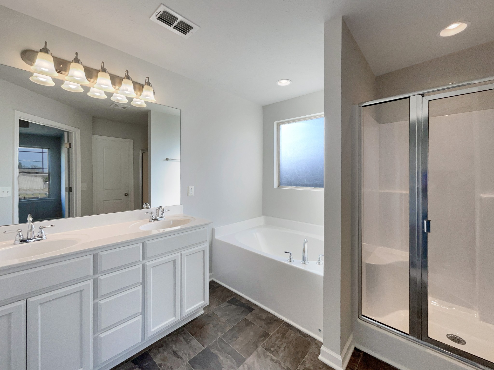 113 Copper Leaf Road Murfreesboro, TN 37128 - Photo 15 of 23 a spacious bathroom with a double vanity sink mirror and bathtub