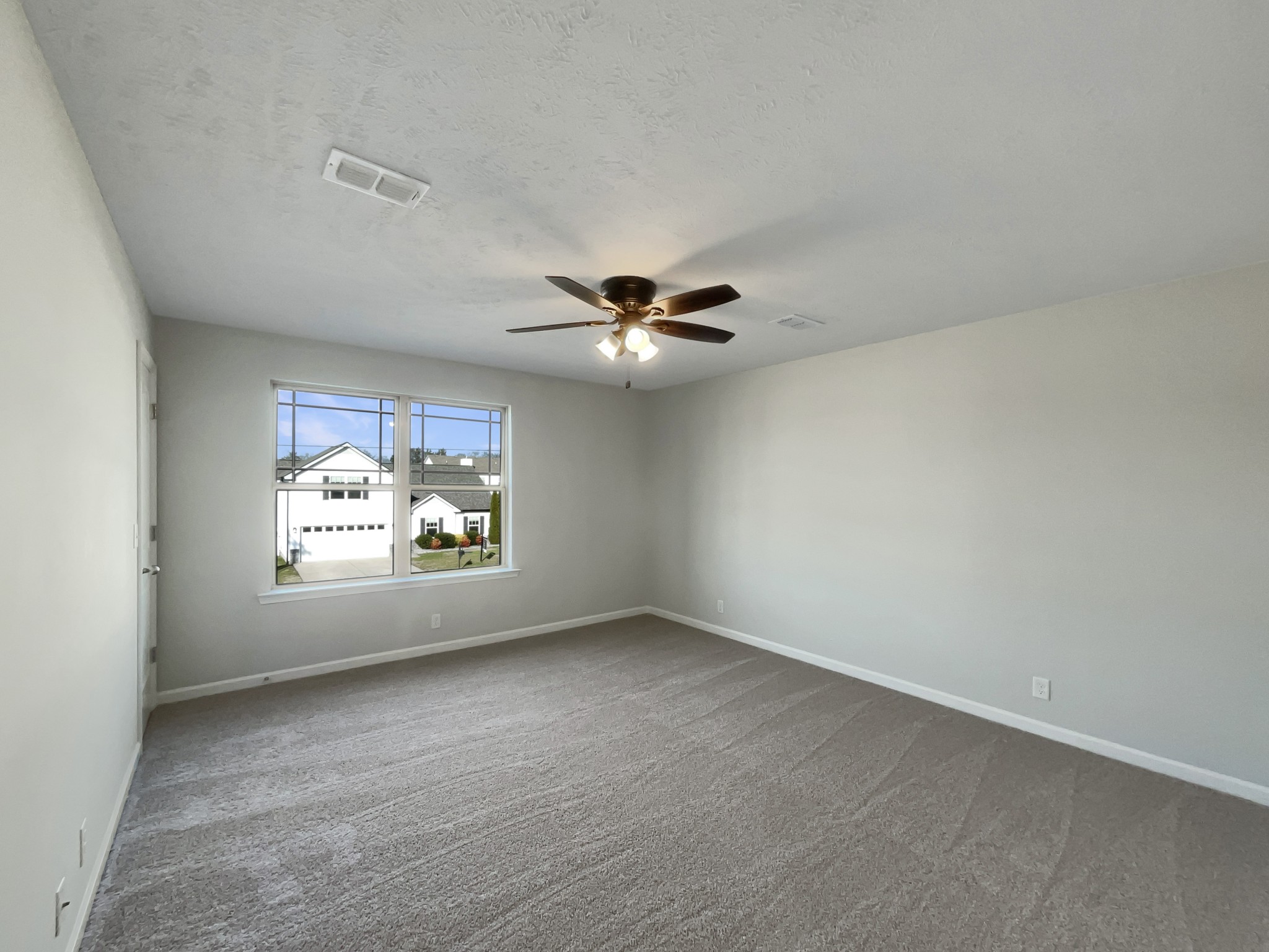 113 Copper Leaf Road Murfreesboro, TN 37128 - Photo 17 of 23 an empty room with a window and ceiling fan