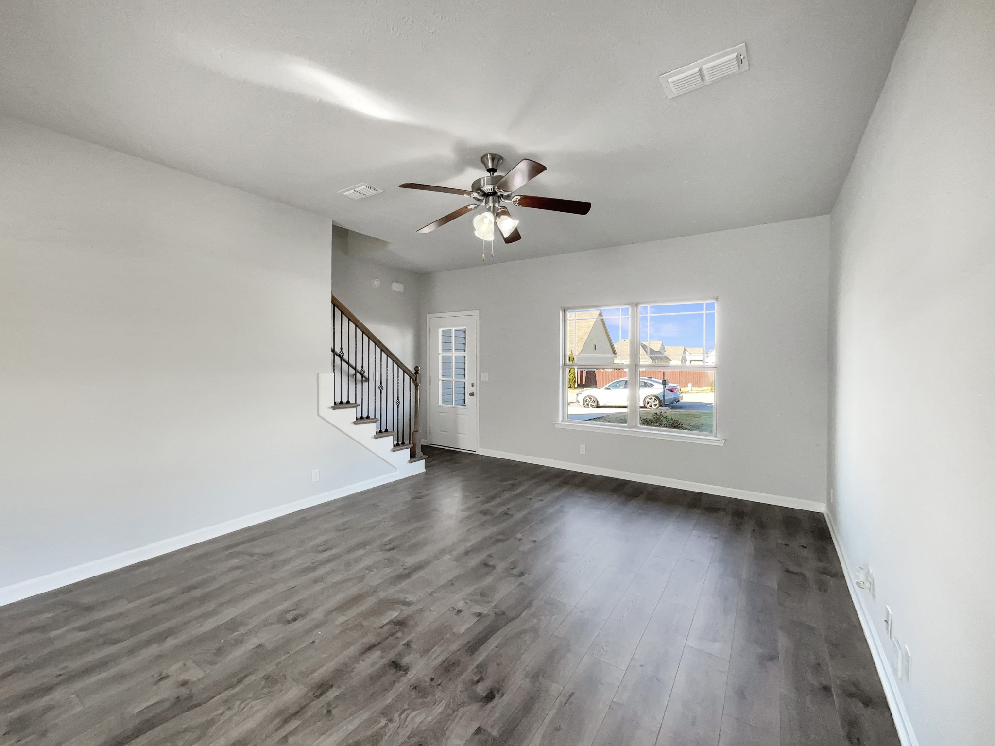 113 Copper Leaf Road Murfreesboro, TN 37128 - Photo 4 of 23 wooden floor in an empty room with a window