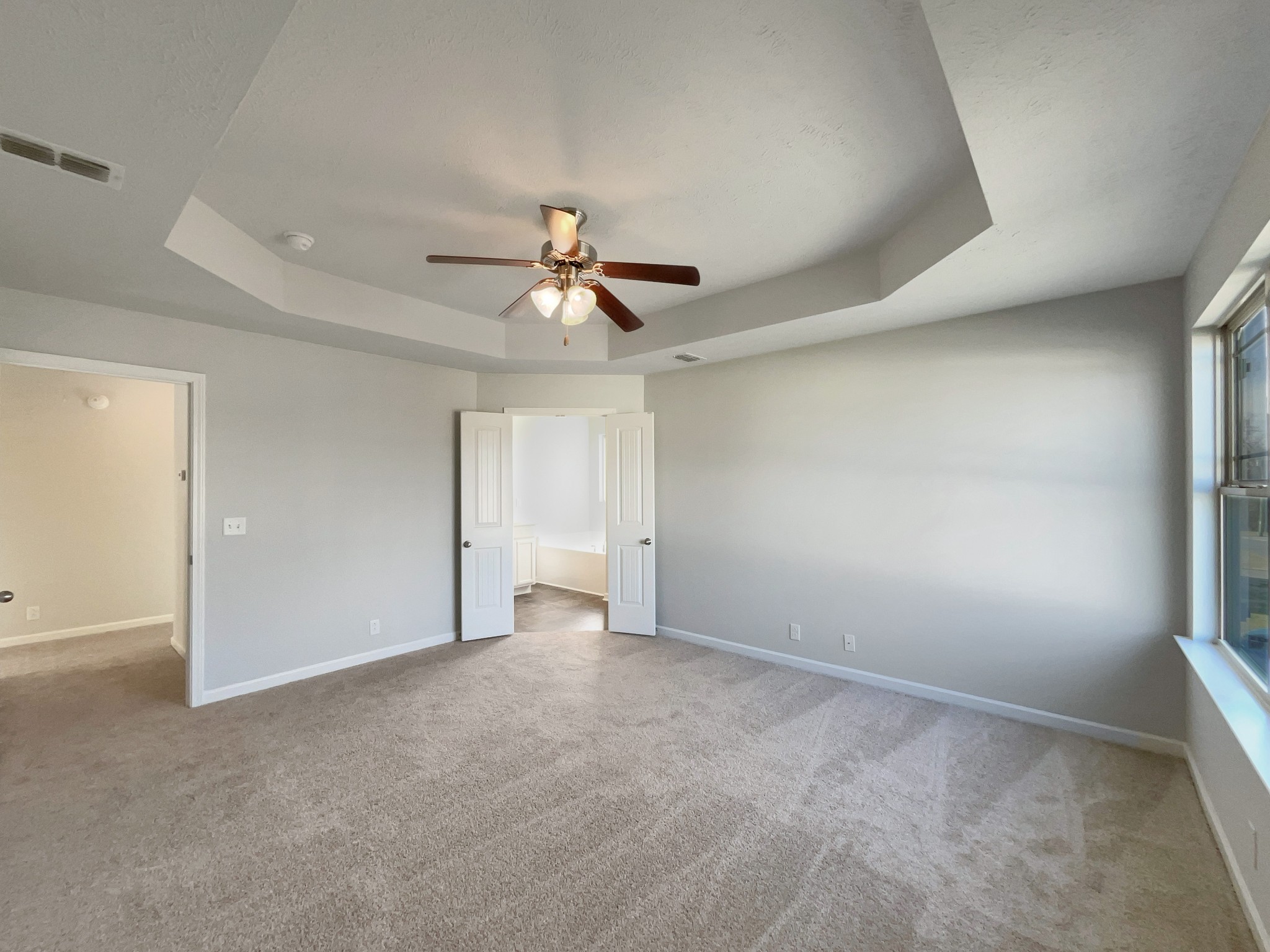 113 Copper Leaf Road Murfreesboro, TN 37128 - Photo 5 of 23 an empty room with a ceiling fan and a window