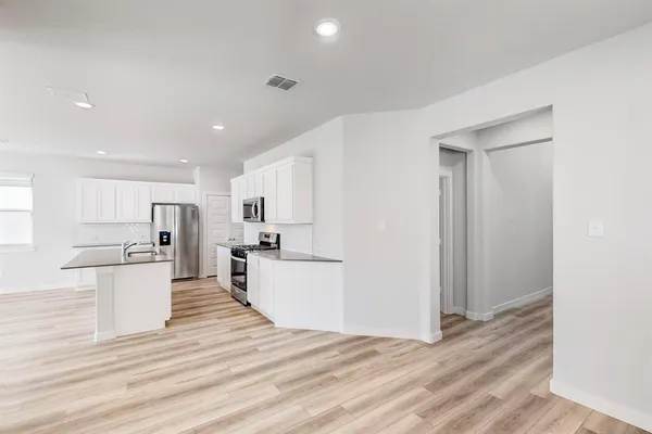 a view of kitchen with wooden floor
