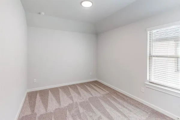 a view of a room that has a window in it