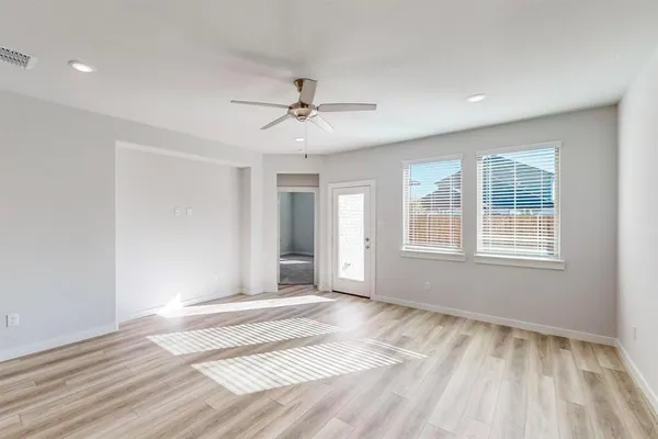 a view of an empty room with a window