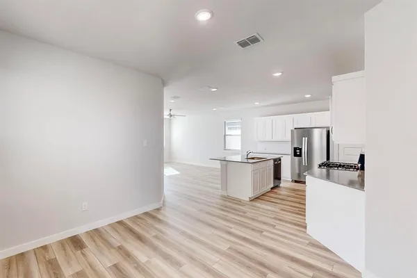 a view of kitchen and wooden floor