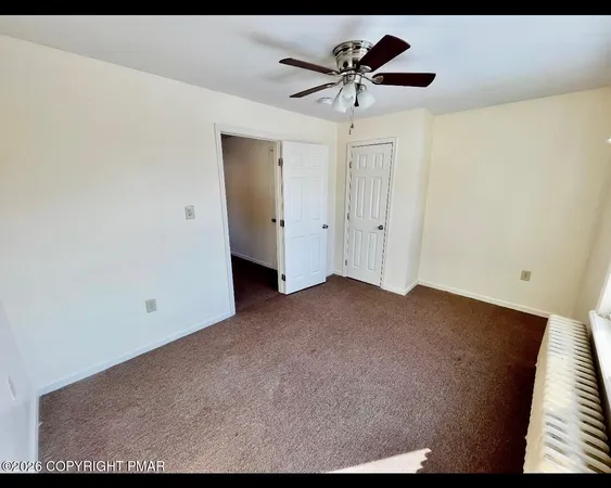 a view of a big room with carpet