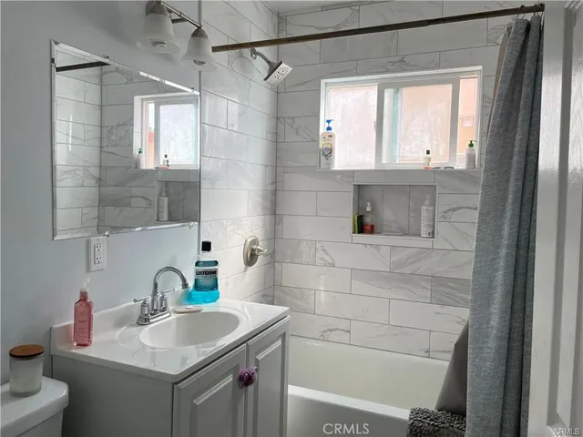 a bathroom with a sink toilet a vanity and shower