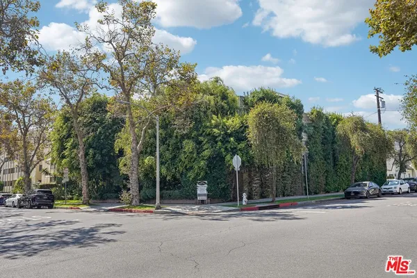 a sign board with a small yard