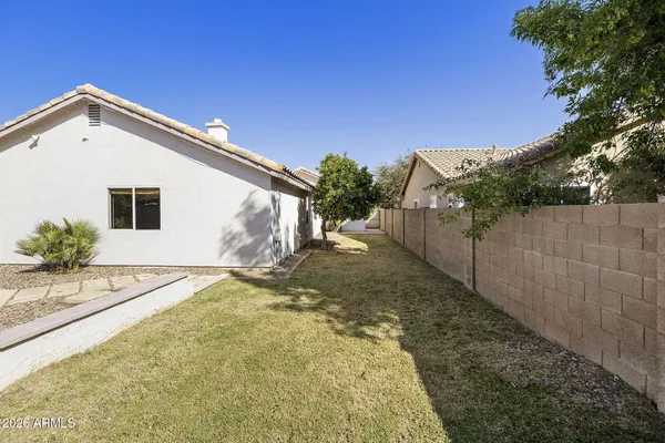a view of backyard of a house
