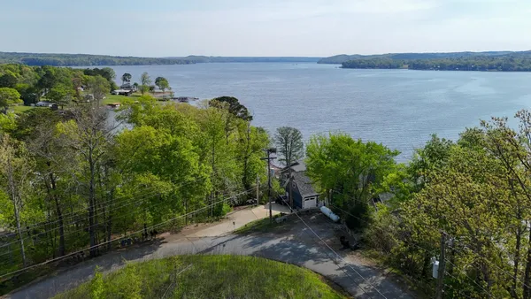 a view of a lake with a yard