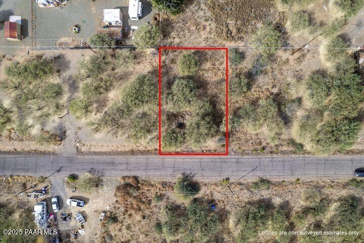 20872 East Cortez Road Mayer, AZ 86333 - Photo 4 of 10 a view of a wooden house with a yard and large trees
