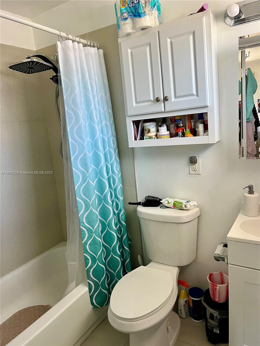 855 West 29th Street, Unit 11 Hialeah, FL 33012 - Photo 8 of 11 a bathroom with a toilet a sink and a shower