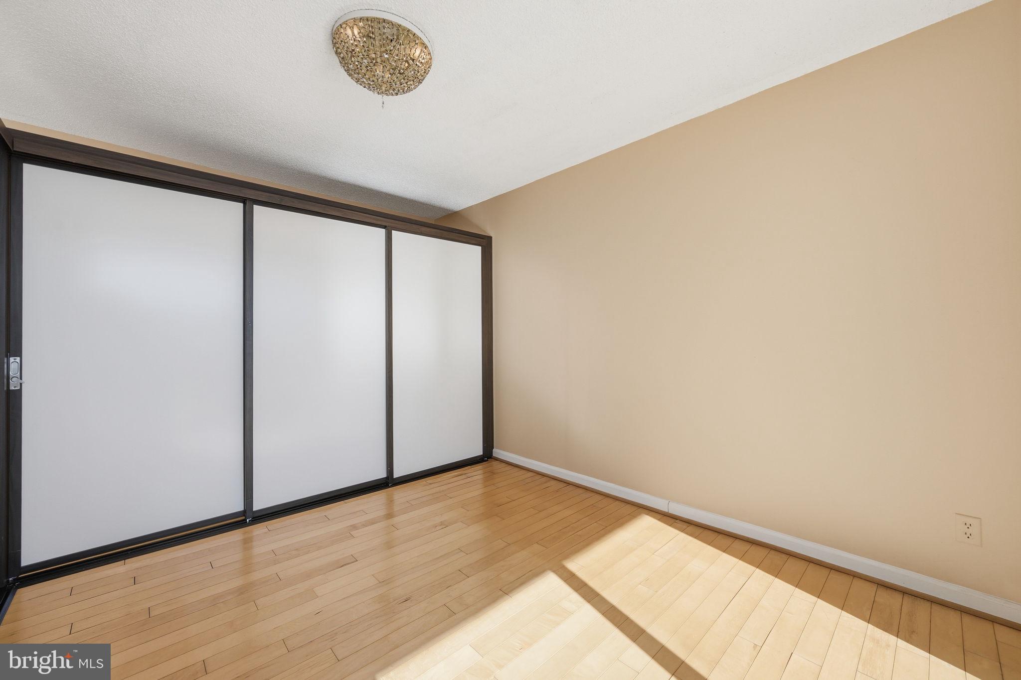 5225 Pooks Hill Road, Unit 519N Bethesda, MD 20814 - Photo 13 of 56 a view of empty room with wooden floor