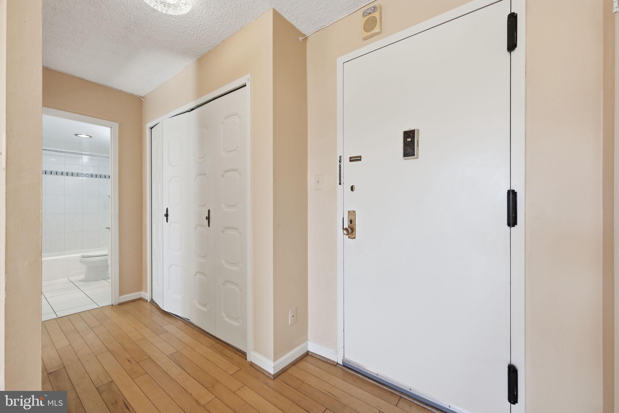 5225 Pooks Hill Road, Unit 519N Bethesda, MD 20814 - Photo 7 of 56 a view of a hallway with wooden floor