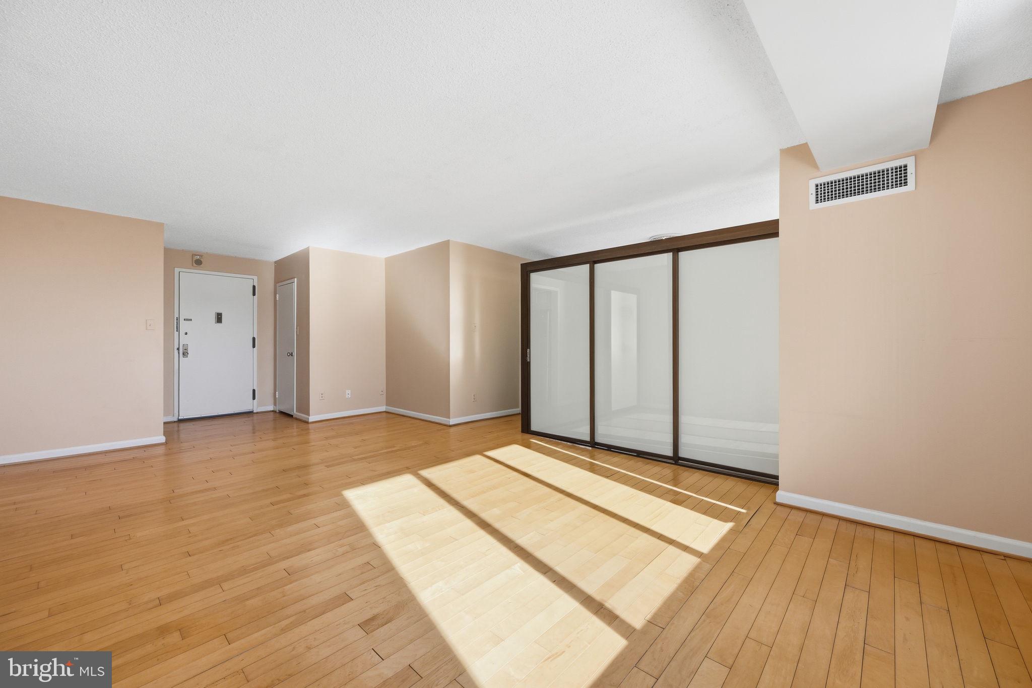5225 Pooks Hill Road, Unit 519N Bethesda, MD 20814 - Photo 9 of 56 a view of an empty room with wooden floor