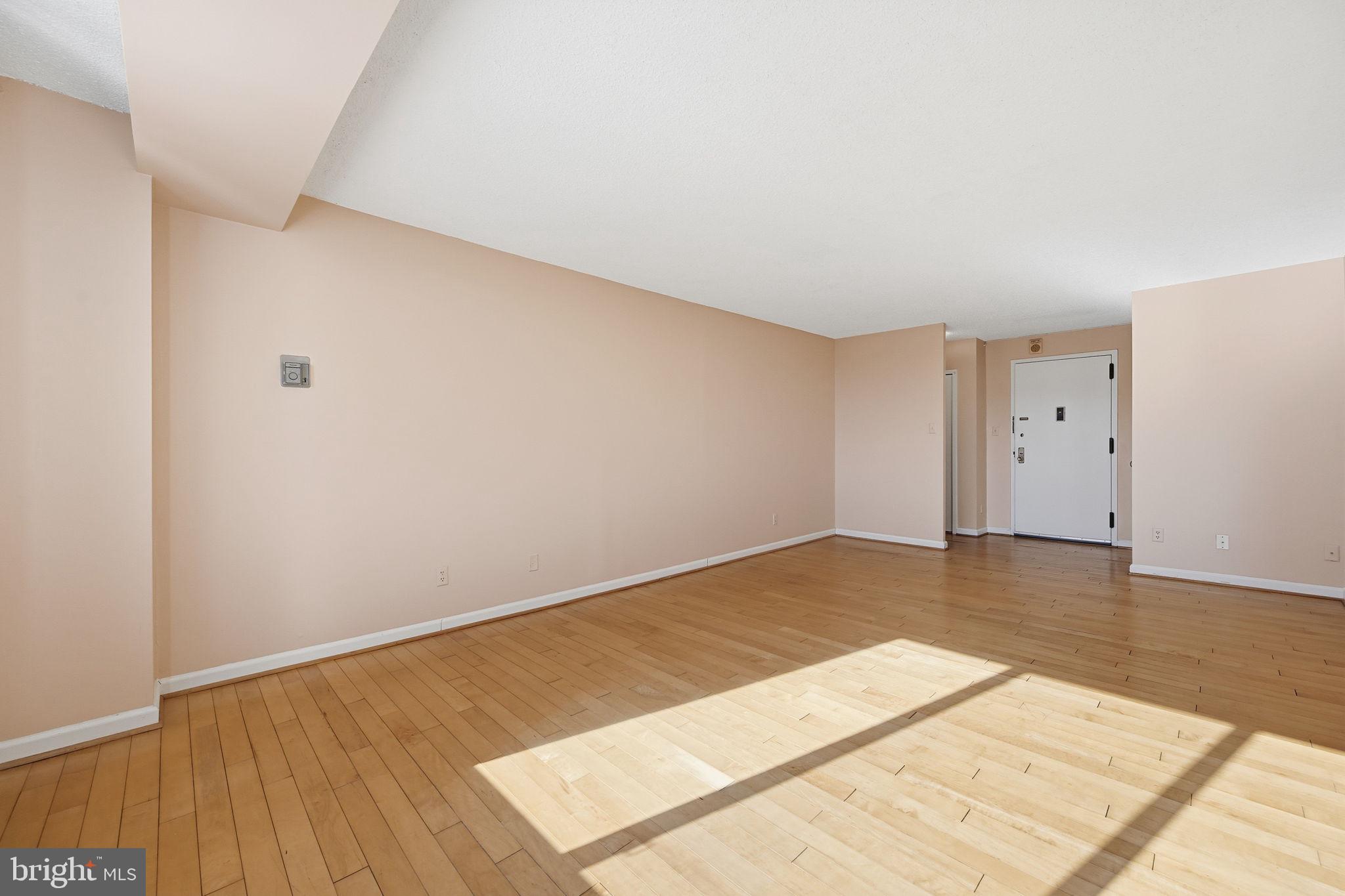 5225 Pooks Hill Road, Unit 519N Bethesda, MD 20814 - Photo 10 of 56 an empty room with wooden floor