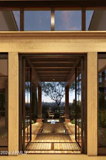 a view of a patio with table and chairs