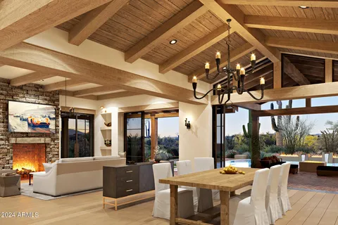 a view of a patio with dining table and chairs