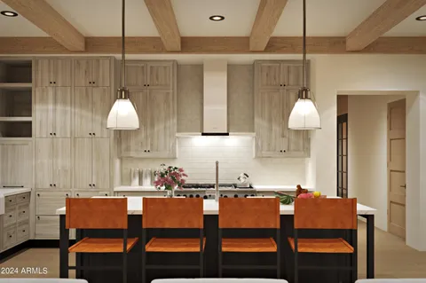 a kitchen with a table chairs and a bed