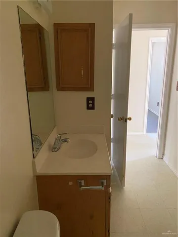 a bathroom with a sink and toilet
