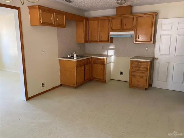 a view of room with cabinets