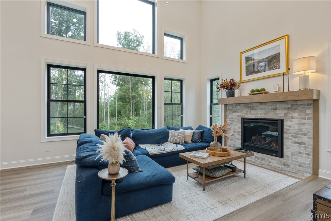 2020 Rubicon Road Lysander, NY 13027 - Photo 9 of 49 A Heat & Glo Arcadia gas fireplace with custom wood mantle and tile surround, perfect to keep you toasty in those cold winter months ahead.