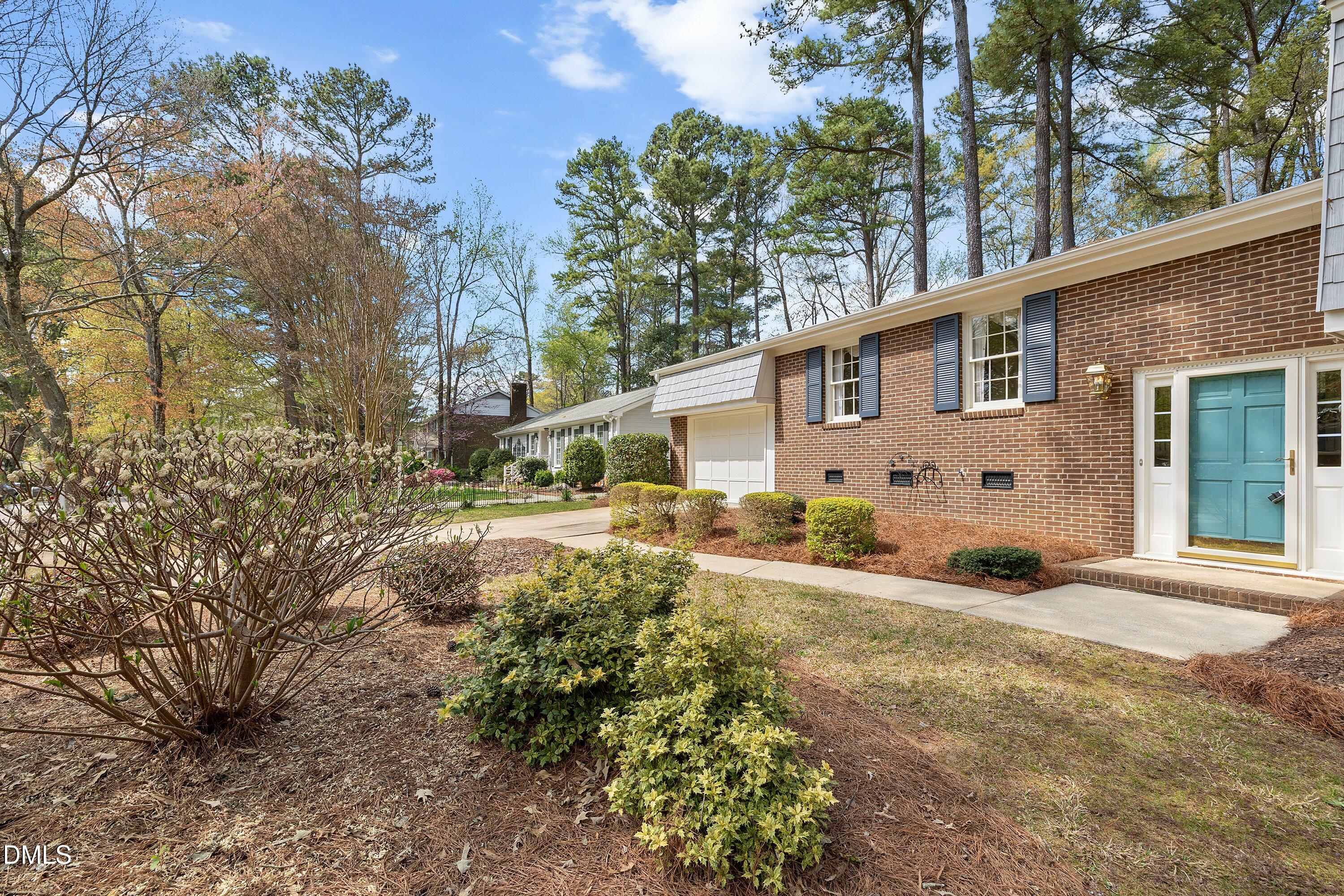1429 Falls Church Road Raleigh, NC 27609 - Photo 11 of 60 a front view of a house with garden