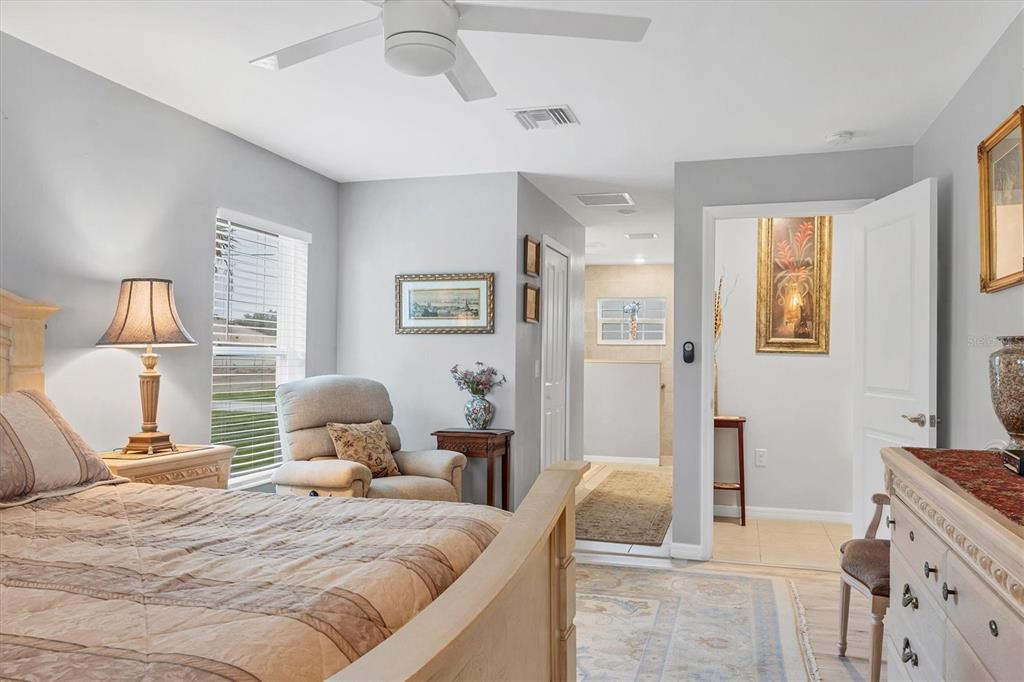 2694 Hopwood Road North Port, FL 34287 - Photo 24 of 56 a bedroom with a bed and a couch