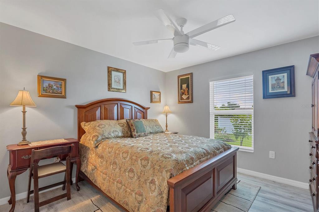 2694 Hopwood Road North Port, FL 34287 - Photo 26 of 56 a bedroom with a large bed and a window