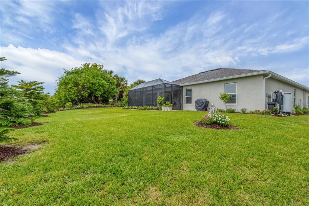 2694 Hopwood Road North Port, FL 34287 - Photo 35 of 56 a front view of house with yard and green space